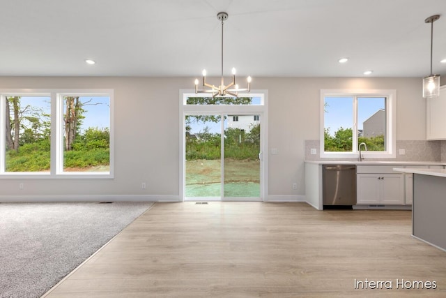 343 Seneca Ridge Dr Unit 40, Middleville, MI 49333 - unfurnished dining area featuring recessed lighting, a chandelier, healthy amount of natural light, and light wood-type flooring