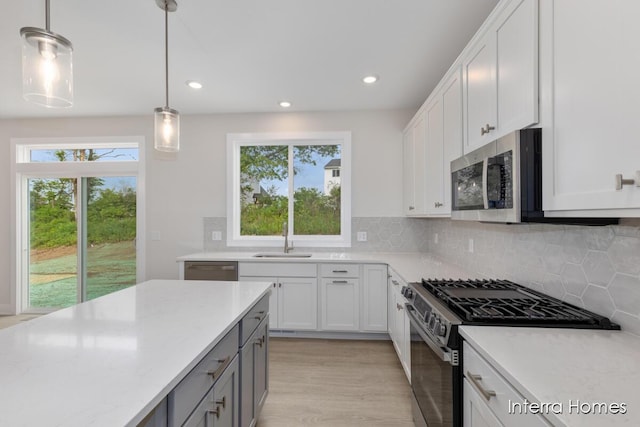 343 Seneca Ridge Dr Unit 40, Middleville, MI 49333 - kitchen with appliances with stainless steel finishes, recessed lighting, healthy amount of natural light, and decorative backsplash