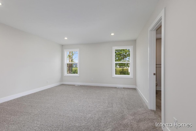343 Seneca Ridge Dr Unit 40, Middleville, MI 49333 - spare room featuring healthy amount of natural light, carpet, and recessed lighting