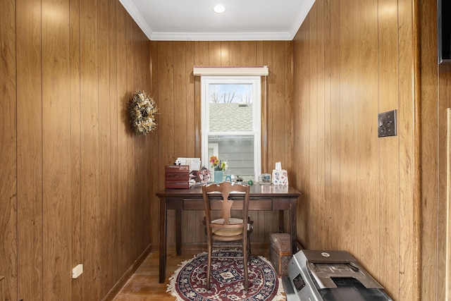 interior space with wood finished floors and crown molding