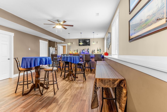 3269 Hopewell Ct NE, Rockford, MI 49341 - dining area featuring light wood-style flooring and a ceiling fan