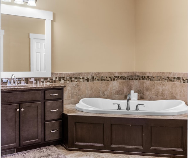 3269 Hopewell Ct NE, Rockford, MI 49341 - full bathroom featuring a garden tub and vanity