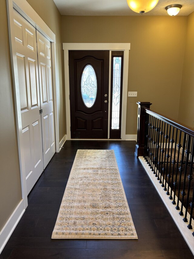 3269 Hopewell Ct NE, Rockford, MI 49341 - foyer with dark wood-style floors and baseboards