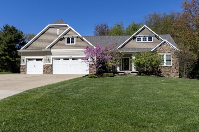 3269 Hopewell Ct NE, Rockford, MI 49341 - craftsman-style home with stone siding, a garage, concrete driveway, and a front lawn
