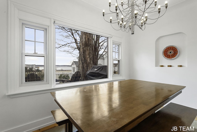 1200 Beach Dr, Holland, MI 49423 - unfurnished dining area with a chandelier