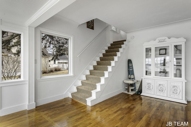 1200 Beach Dr, Holland, MI 49423 - staircase featuring hardwood / wood-style flooring and baseboards