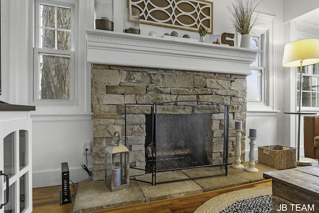 1200 Beach Dr, Holland, MI 49423 - detailed view of a stone fireplace and wood finished floors