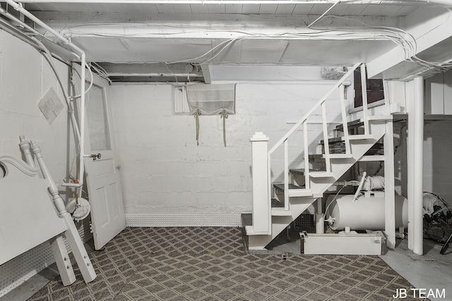 1200 Beach Dr, Holland, MI 49423 - unfinished basement with tile patterned floors and stairway