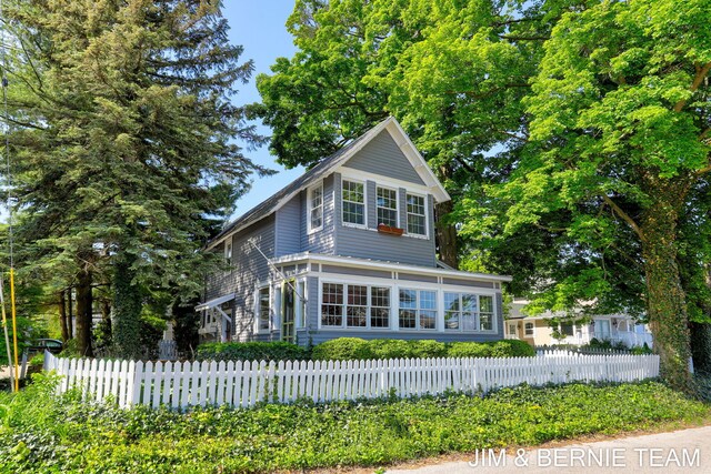 1200 Beach Dr, Holland, MI 49423 - view of front of property with a fenced front yard
