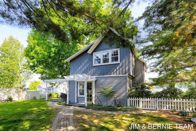 1200 Beach Dr, Holland, MI 49423 - view of front facade featuring a pergola and a patio