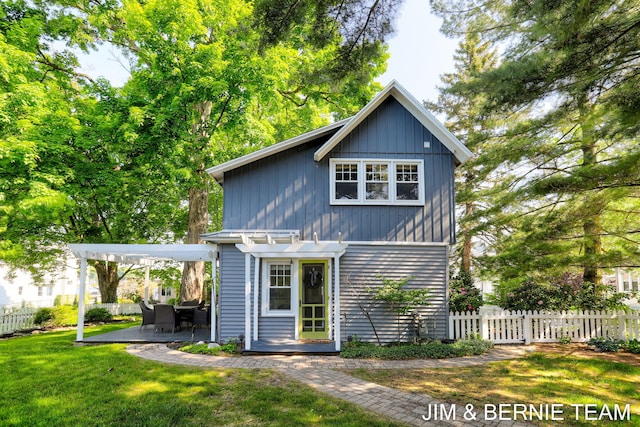 1200 Beach Dr, Holland, MI 49423 - back of property featuring a pergola and a patio