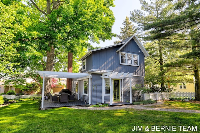 1200 Beach Dr, Holland, MI 49423 - rear view of house with a pergola, a deck, a standing seam roof, and metal roof