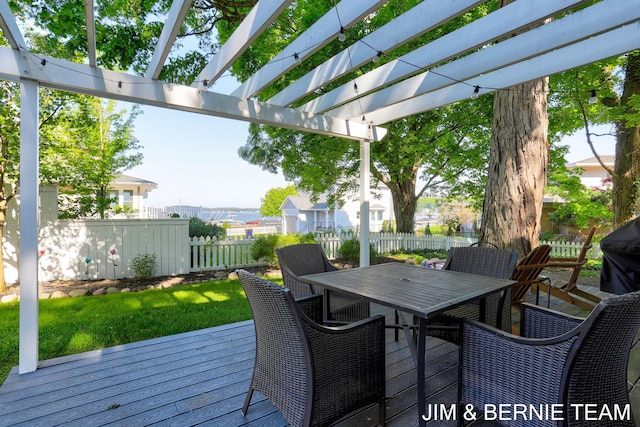 1200 Beach Dr, Holland, MI 49423 - wooden terrace featuring outdoor dining area and a pergola