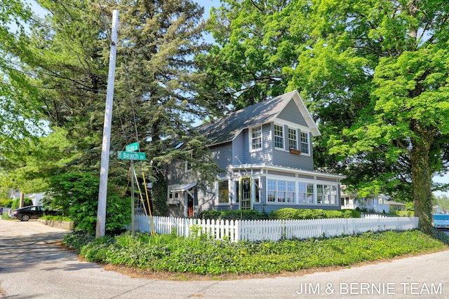 1200 Beach Dr, Holland, MI 49423 - view of front of home featuring a fenced front yard