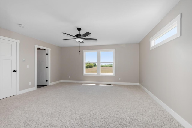 144 9 Mile Rd NW, Comstock Park, MI 49321 - unfurnished room featuring carpet, baseboards, ceiling fan, and a smoke detector