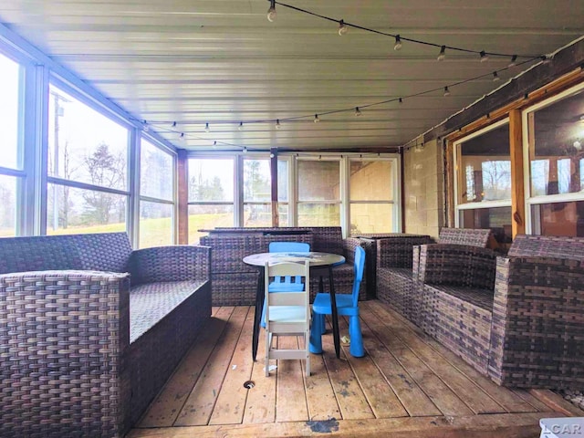 13936 Allen Rd, Clinton, MI 49236 - sunroom with track lighting and an outdoor hangout area