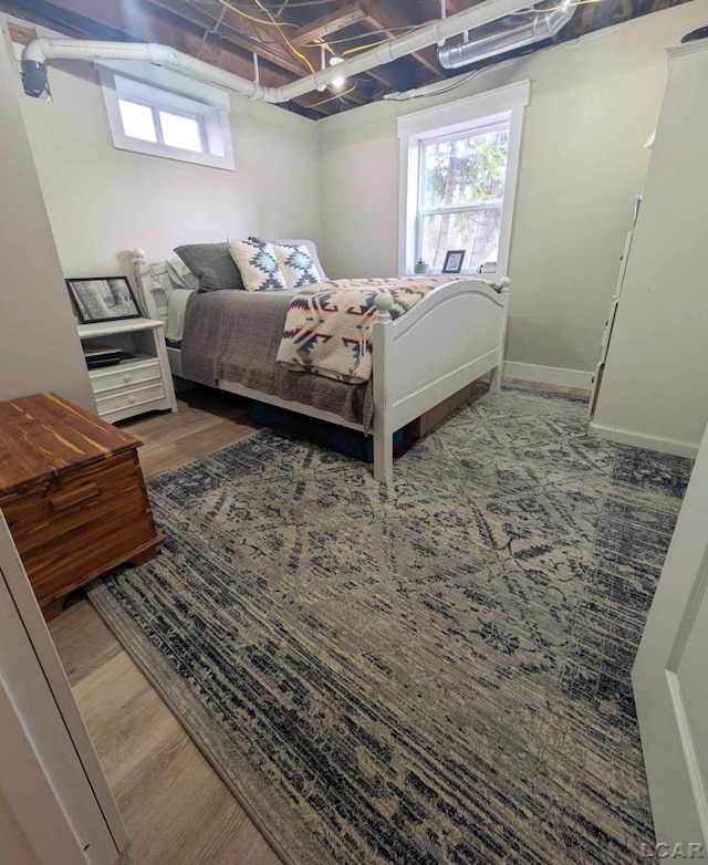 13936 Allen Rd, Clinton, MI 49236 - bedroom featuring wood finished floors and multiple windows