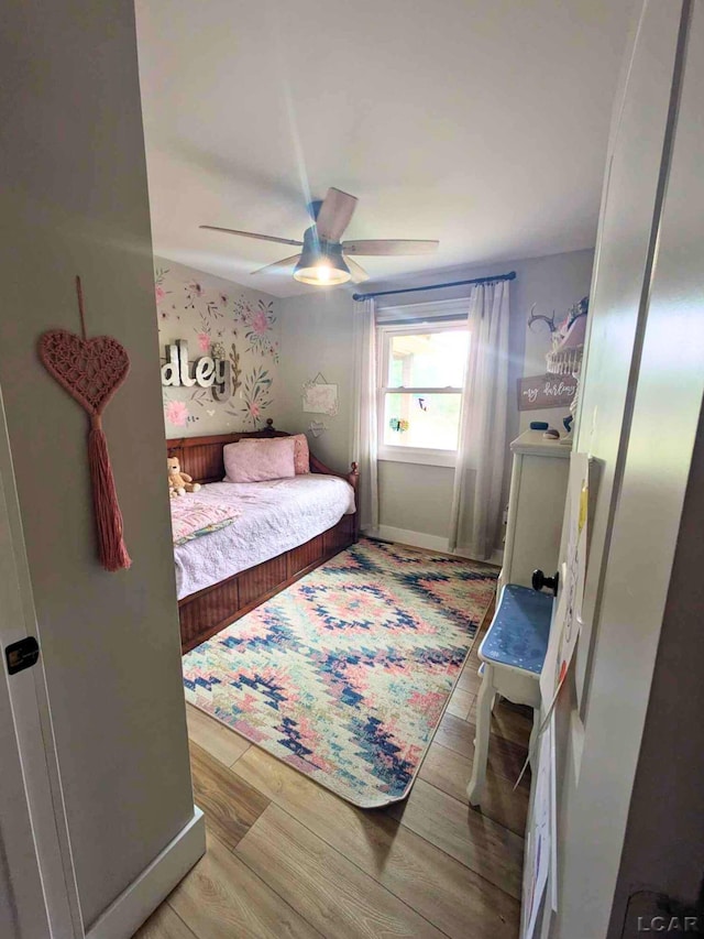 13936 Allen Rd, Clinton, MI 49236 - bedroom featuring light wood-style floors and ceiling fan