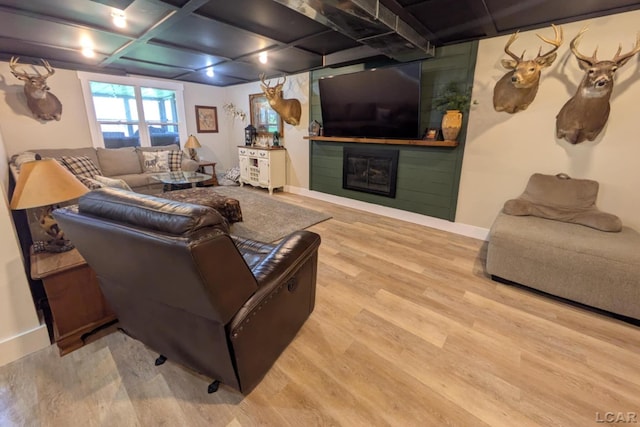 13936 Allen Rd, Clinton, MI 49236 - living area featuring baseboards, wood finished floors, and a large fireplace