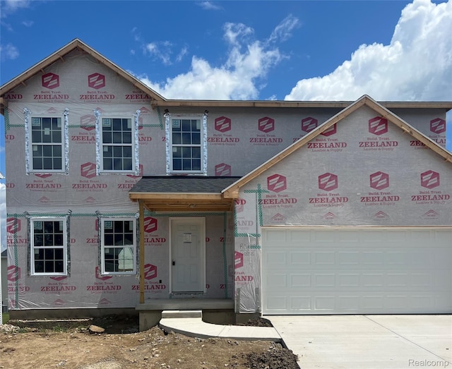8286 Majestic Blvd, Fowlerville, MI 48836 - unfinished property with concrete driveway and a garage