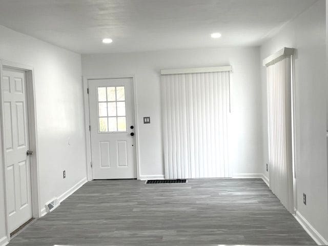 foyer with baseboards, recessed lighting, and wood finished floors
