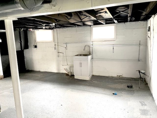 basement featuring a sink
