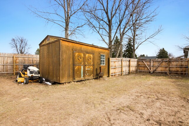 5278 W Mobile Trl, Traverse City, MI 49685 - view of shed featuring a fenced backyard