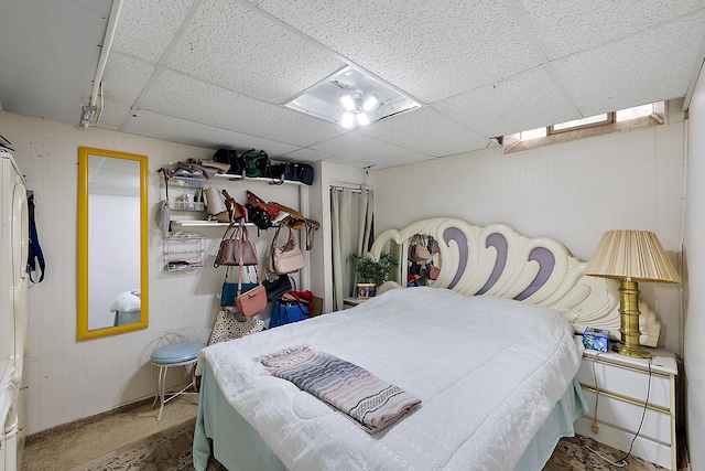 bedroom featuring a drop ceiling