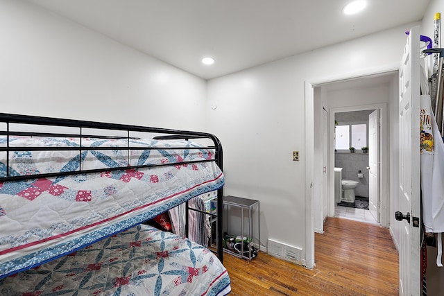 bedroom featuring visible vents, recessed lighting, and wood finished floors