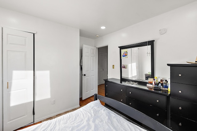 bedroom featuring recessed lighting, wood finished floors, and baseboards