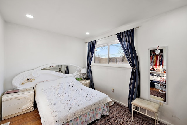 bedroom featuring recessed lighting, baseboards, and wood finished floors