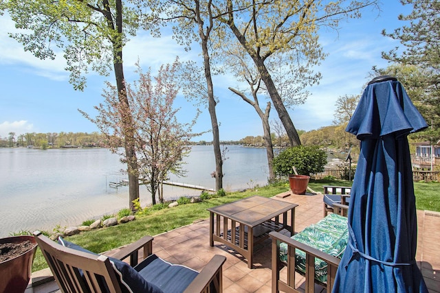 47463 Lakeview Dr, Lawrence, MI 49064 - view of patio / terrace with a water view and fence