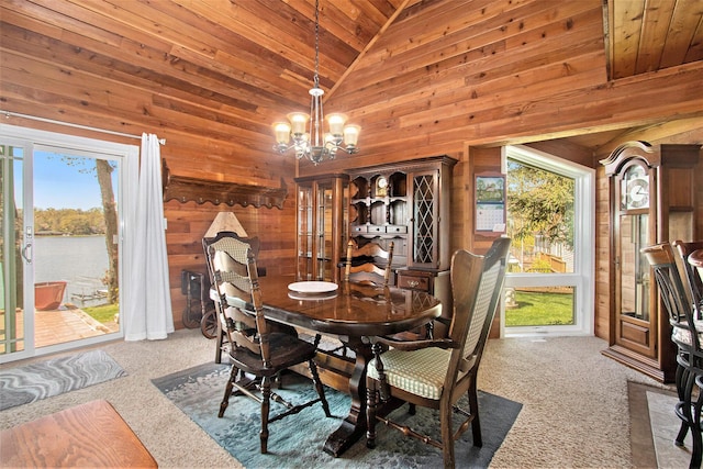 47463 Lakeview Dr, Lawrence, MI 49064 - dining space featuring wooden walls, carpet floors, wood ceiling, a chandelier, and lofted ceiling