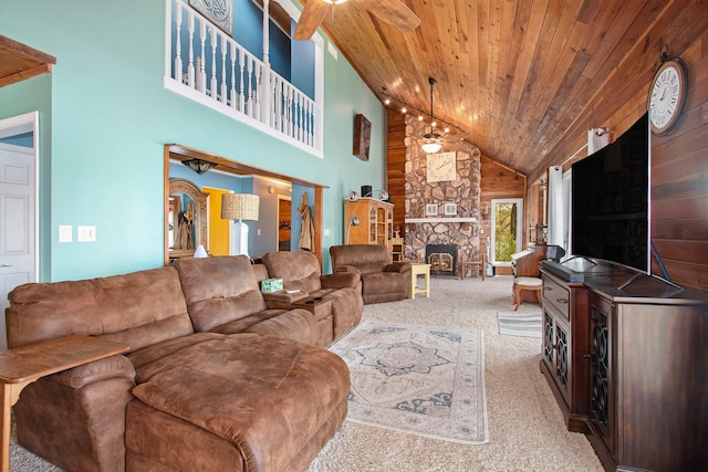 47463 Lakeview Dr, Lawrence, MI 49064 - living area featuring carpet, wooden ceiling, high vaulted ceiling, a fireplace, and wooden walls