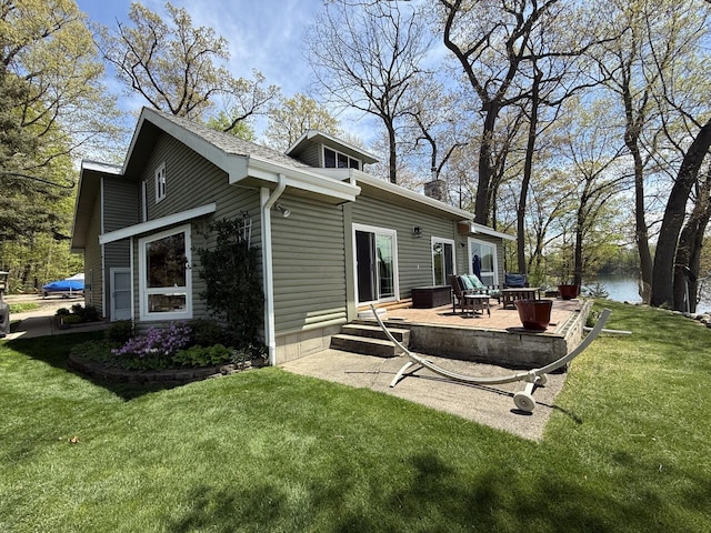 47463 Lakeview Dr, Lawrence, MI 49064 - back of property featuring a lawn, a deck, and a chimney