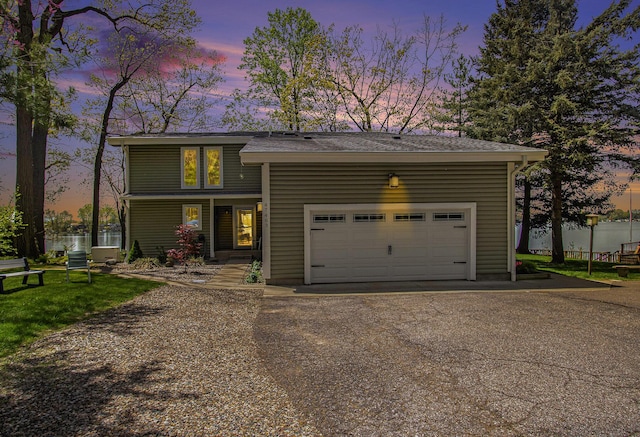 47463 Lakeview Dr, Lawrence, MI 49064 - view of front of home with a garage, asphalt driveway, and a shingled roof