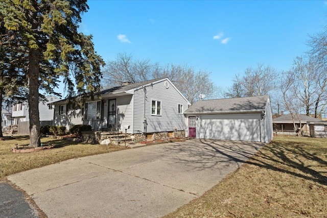 view of side of home with a lawn, a chimney, and a detached garage