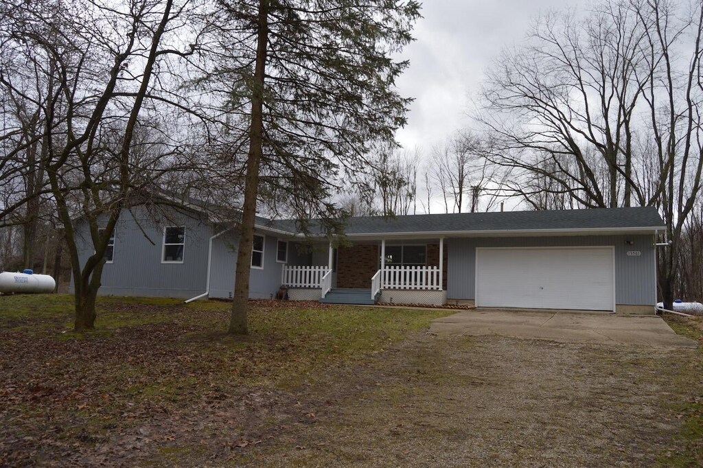 13561 27 Mile Rd, Albion, MI 49224 - ranch-style home with covered porch, an attached garage, and driveway