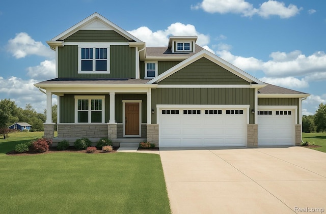 571 Birkdale, Howell, MI 48843 - craftsman inspired home featuring board and batten siding, concrete driveway, an attached garage, a front yard, and stone siding