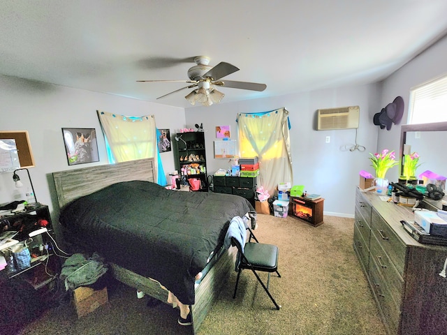bedroom with ceiling fan, a wall unit AC, and carpet