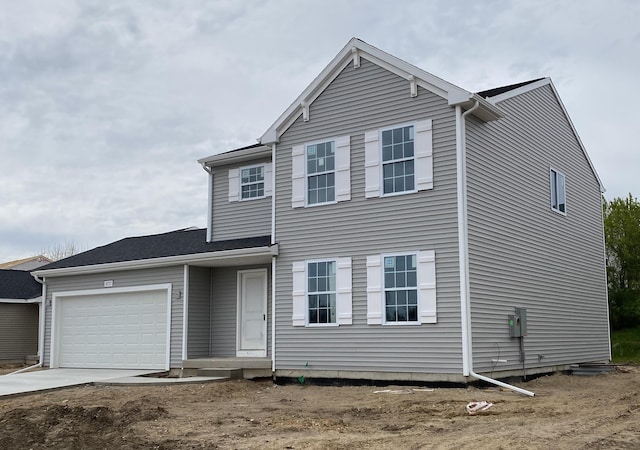 8727 E Sturtevant Ave, Richland, MI 49083 - view of front of house featuring a garage and concrete driveway
