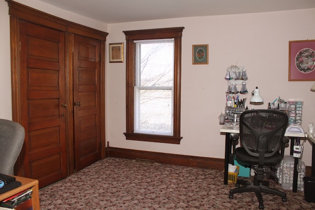 office space with baseboards