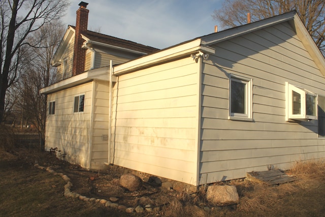 view of home's exterior featuring a chimney