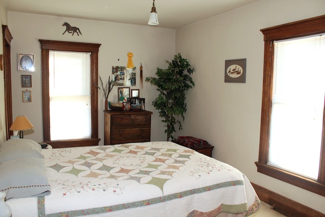 bedroom with multiple windows