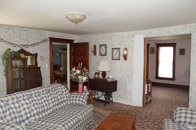 carpeted living room with baseboards and wallpapered walls