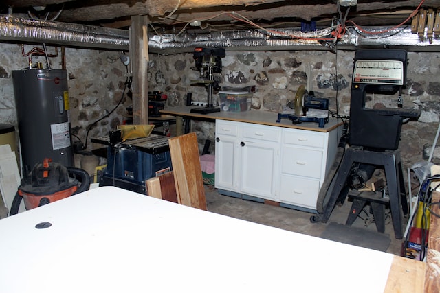 unfinished basement with electric water heater