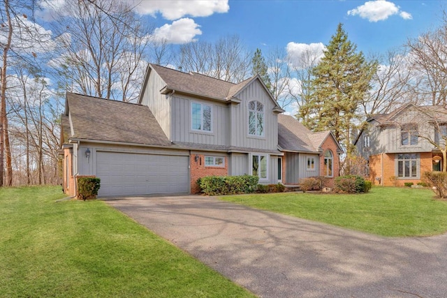 view of front of property with aphalt driveway, an attached garage, board and batten siding, and a front yard