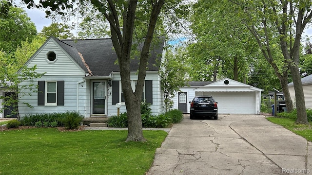 15882 Lennane, Redford, MI 48239 - view of front facade with a front yard, driveway, a shingled roof, an attached garage, and an outbuilding