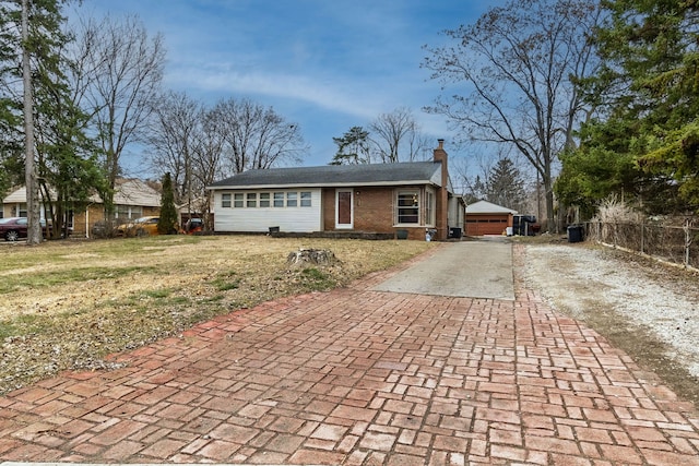 2174 Middlebelt Rd, West Bloomfield, MI 48324 - single story home featuring fence, brick siding, a front yard, a chimney, and decorative driveway