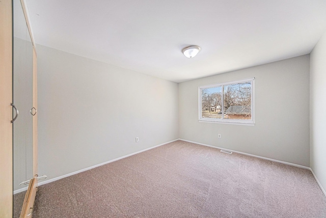 1019 Colony Dr, Saline, MI 48176 - unfurnished room featuring visible vents, baseboards, and carpet